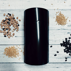 Medium Seed Storage Vault by Seed Vaults, 1.3-liter capacity, 8 inches tall, with secure lid and clear container for seed preservation.